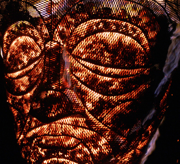 Close up of a Hot Head - charcoal fire sculpture made with pa-Boom